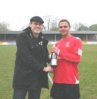 Sponsor Mark Jones presents MotM bubbly to Joel Ledgister